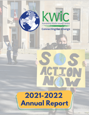 Cover page of KWIC 2021-2022 Annual Report - photo of youth holding a sign that says SOS Action Now with earths for "o"s